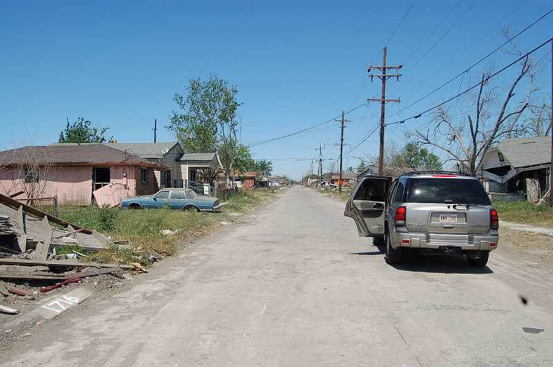 New Orleans 04-08-06 023.JPG - A typical street in the 9th Ward of New Orleans.  The area, populated by low income residents, was hit hard when the levees along the industrial canal were breached.   After six months, little progress in resurrecting the area has been made.  It still has little electric power and no potable water.  Government delays in deciding whether residences will be allowed in the area are discouraging individual efforts to rebuild.